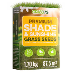 Grassias Premium Shade & Sunshine Grass Seeds box (1.70 kg) with a warm yellow and green design featuring a sunlit lawn background. The packaging promotes a healthy lawn in both shade and sun, with three simple steps — Spread, Water, Grow — shown as green icons. Coverage is listed as 87.5 m², with new lawn coverage of 50 m². The box includes a built-in seed applicator and tips for success on the side panel.