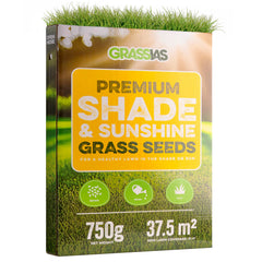 Grassias Premium Shade & Sunshine Grass Seeds box (750 g) with a warm yellow and green design featuring a sunlit lawn background with soft bokeh light effects. The packaging promotes a healthy lawn in both shade and sun, with three simple steps — Spread, Water, Grow — shown as green icons. Coverage is listed as 37.5 m², with new lawn coverage of 21 m².