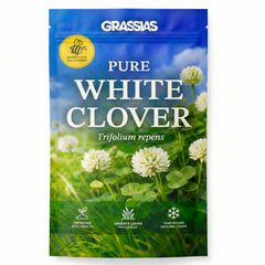 Grassias Pure White Clover (Trifolium repens) resealable pouch with a blue and green design featuring a close-up photograph of white clover flowers in bloom. The packaging includes a "Perfect for Pollinators" badge with a bee icon, and highlights three key benefits: Improves Soil Health, Greener Lawns Naturally, and Year-Round Ground Cover.